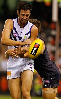 AFL 2013 NAB Cup Rd 02 - Carlton v Fremantle Carlton's Marc Murphy tackles Fremantle's Tanner Smith during the 2013 NAB Cup round 02 match between the Carlton Blues and the Fremantle Dockers at Etihad Stadium, Melbourne. (Photo: Andrew White/AFL Media)